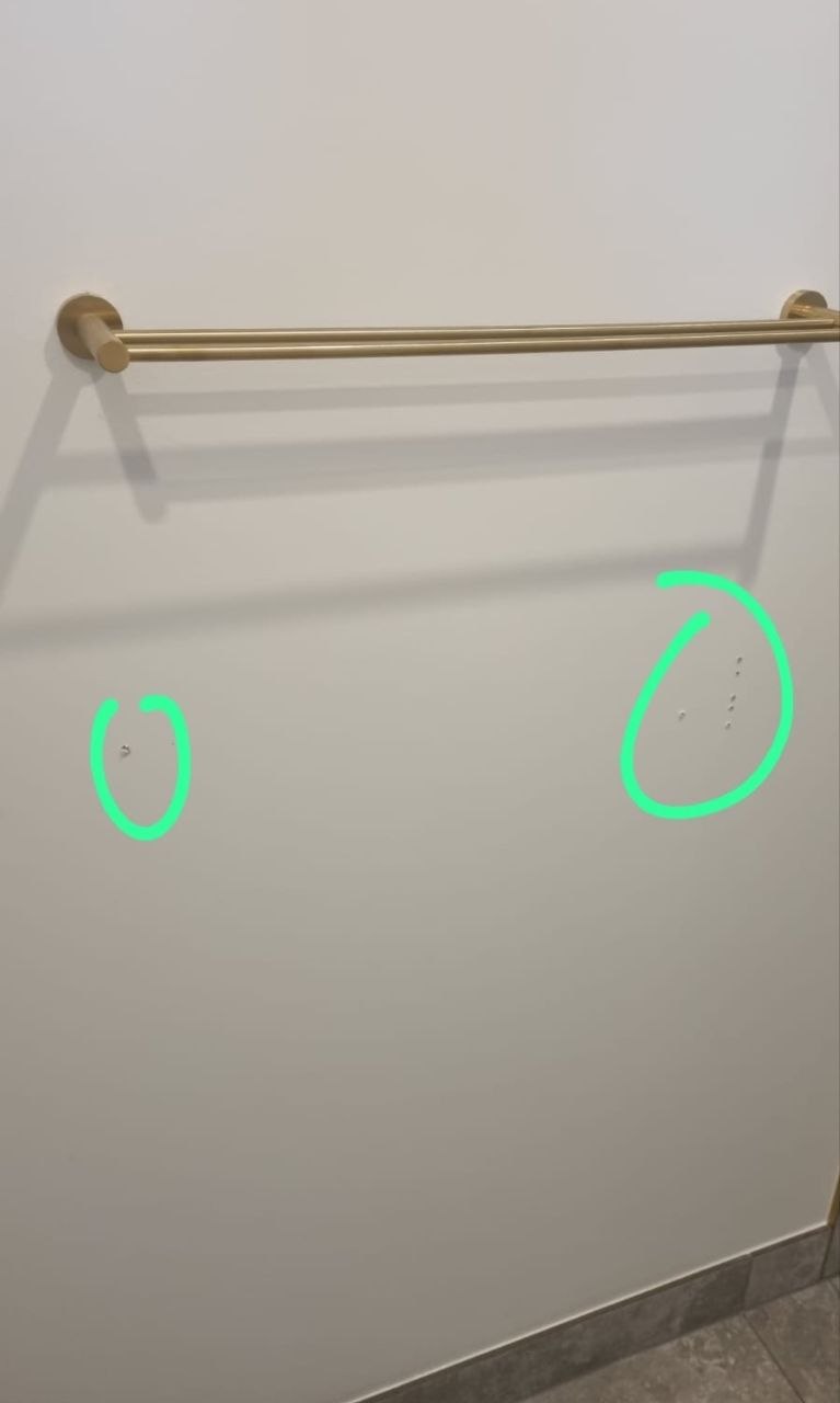 Defect report photo from a Melbourne new build, unfilled fixing holes circled for the builder to correct before handover